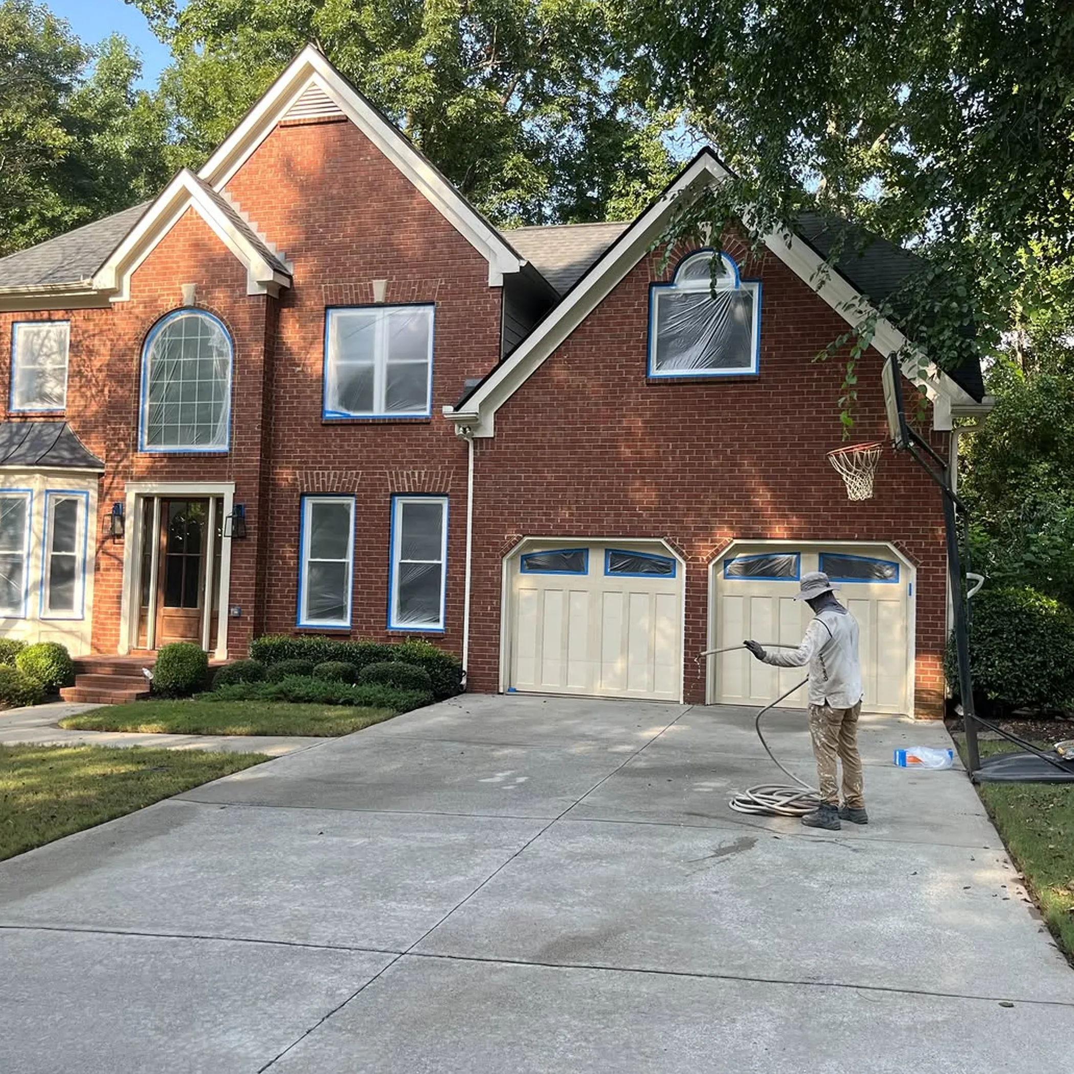 driveway being pressure washed outdoors
