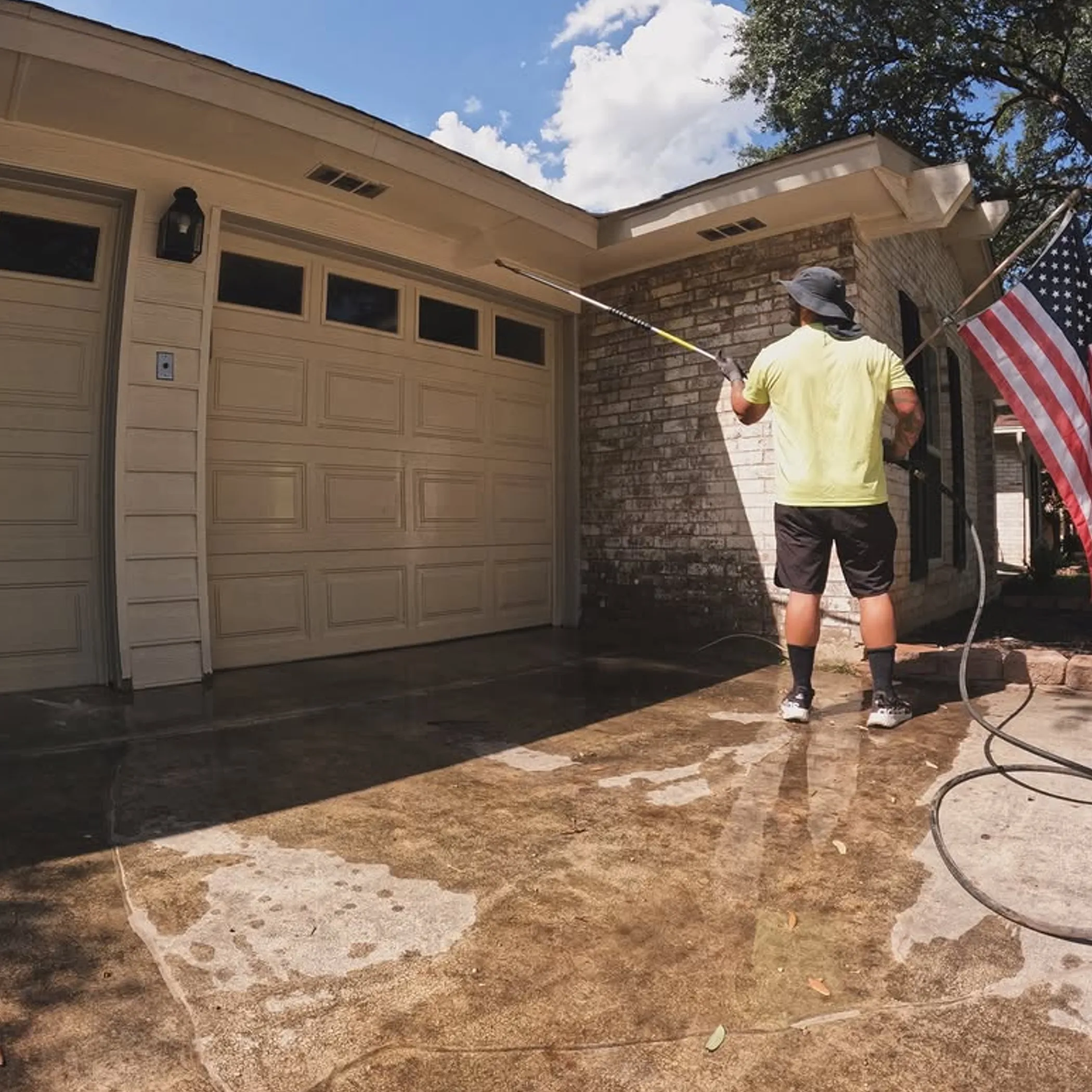 driveway being pressure washed outdoors