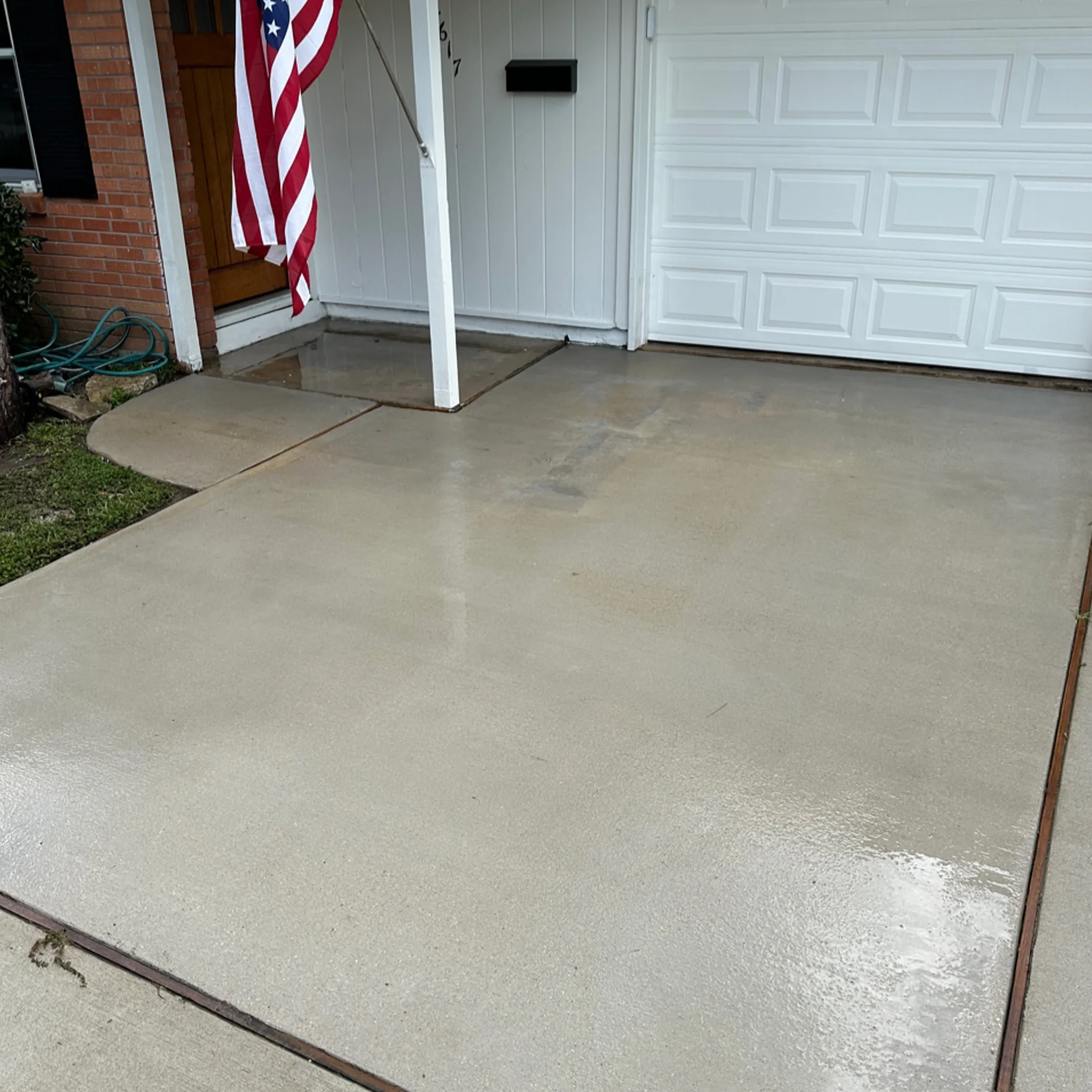 clean wet driveway after washing