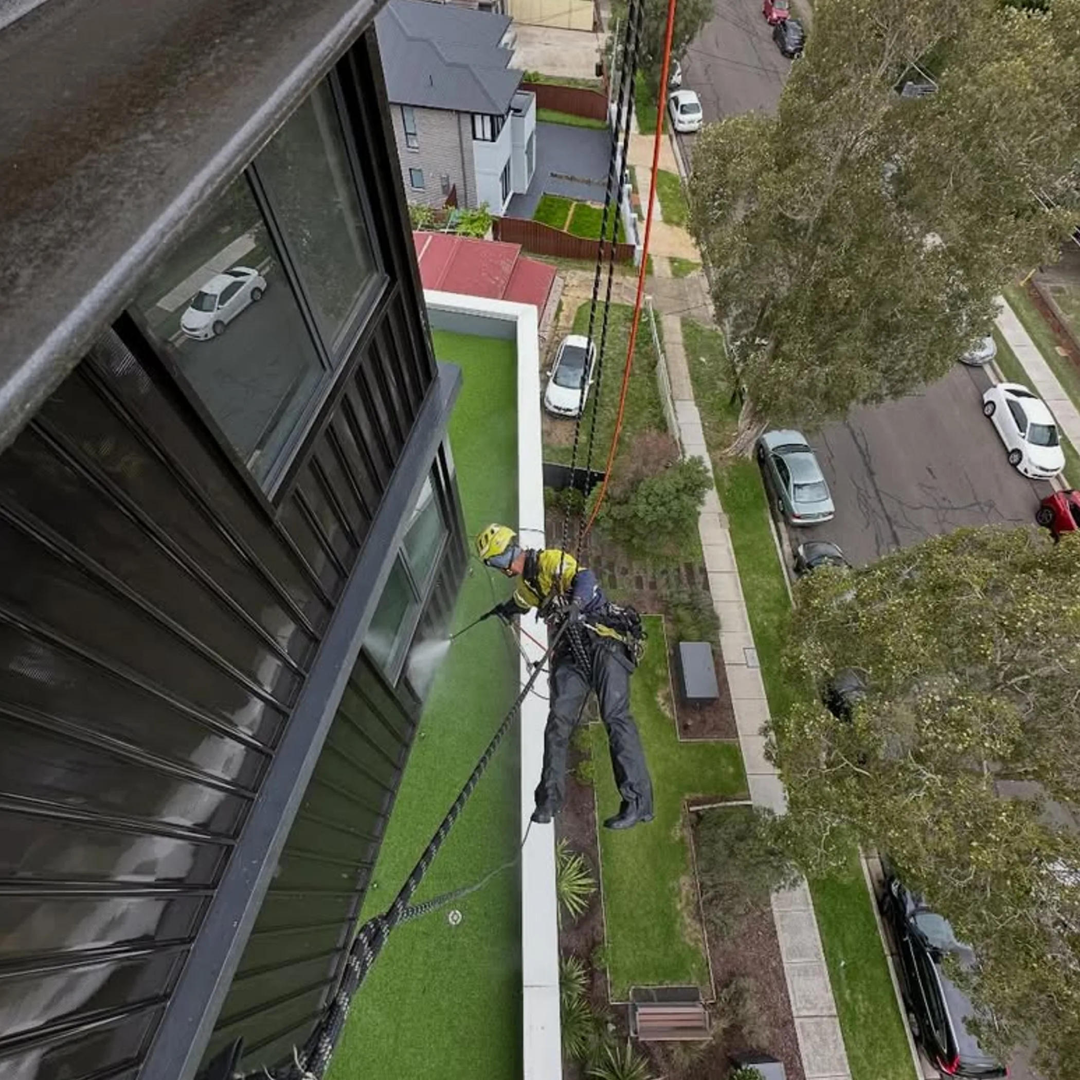 rope access pressure washing building exterior