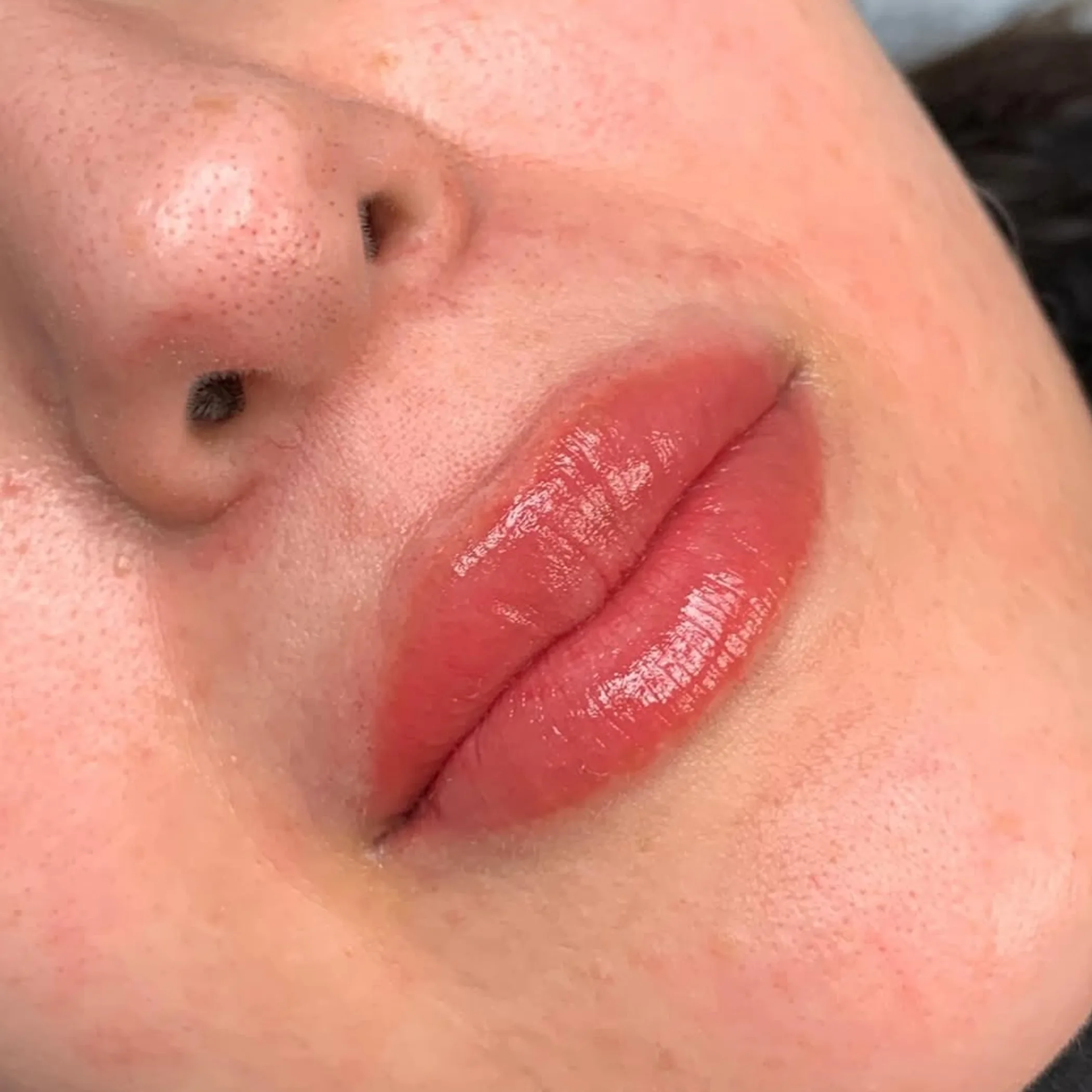 woman receiving permanent makeup treatment