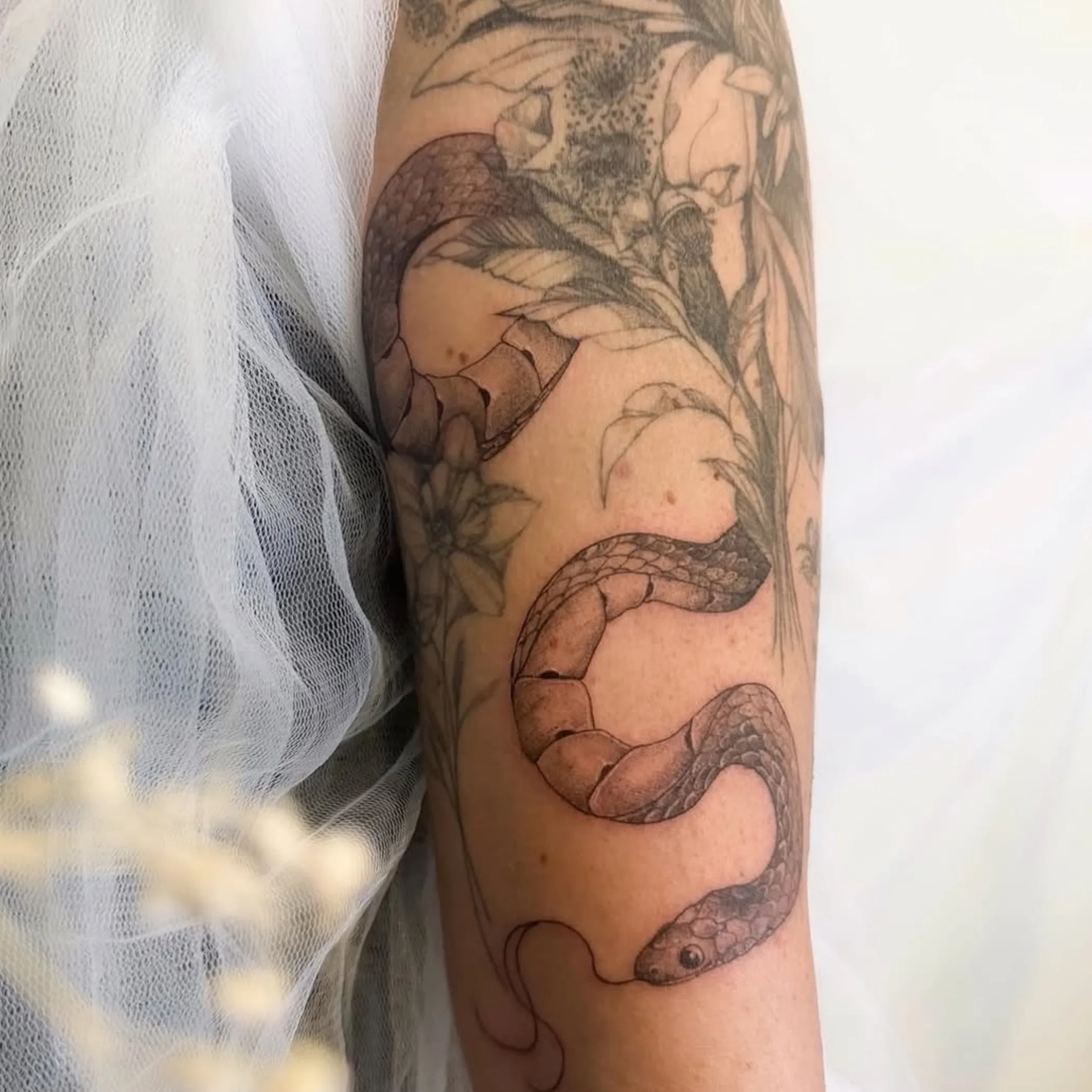 daisy and snake tattoo